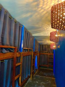 a room with blue walls and a blue ceiling at Jaydy hostel in General Luna