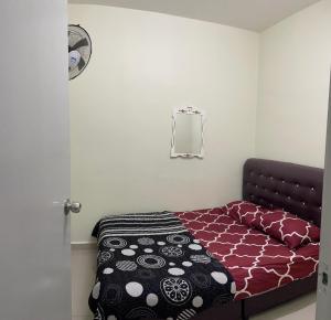 Ένα ή περισσότερα κρεβάτια σε δωμάτιο στο Babamoon Homestay