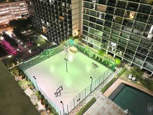 an aerial view of a tennis court in front of a building at Mount Austin Retreat in Johor Bahru