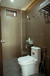 a small bathroom with a toilet and a window at Nori Home Đà Lạt in Da Lat +74 photos