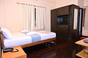 Säng eller sängar i ett rum på Jaya Paradise