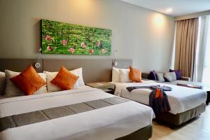 Postel nebo postele na pokoji v ubytování Qliq Damansara Hotel