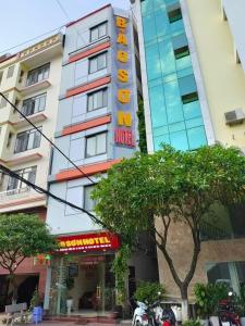 a hotel with a sign on the side of a building at Khách sạn Bảo Sơn 1 in Lao Cai