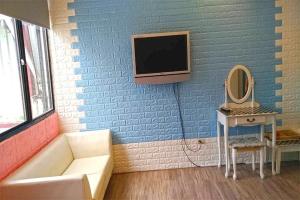 TV a/nebo společenská místnost v ubytování Star Moon Forest Inn