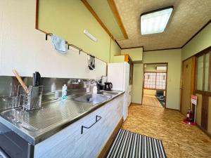 a kitchen with a sink and a counter top at Calmbase Nishi Izu - Vacation STAY 30929v in Toda