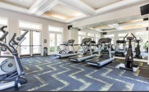 a fitness room with treadmills and elliptical machines at The Plaisir - Pool & Spa in Santa Clarita