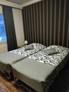 Un pat sau paturi într-o cameră la Hotel Ackas