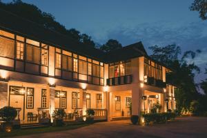 a large house with lights on at night at Labrador Villa in Singapore