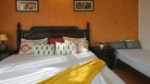 Letto o letti in una camera di Prakash Kutir B&B