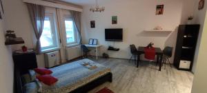 Televízia a/alebo spoločenská miestnosť v ubytovaní Mester24 Apartman + 6 fotografií