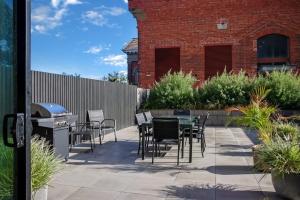 a patio with chairs and a table and a grill at Retreat on Bellerine I Corporate or Getaway in Geelong