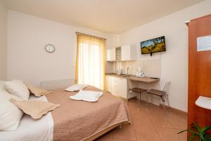 Postel nebo postele na pokoji v ubytování Apartmani Trogir