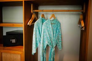 a robe hanging on a rack in a closet at Ecozy Dijiwa Canggu in Canggu
