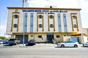 a building with cars parked in front of it at فندق بلانتي 2 in Al Madinah