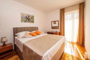 Postel nebo postele na pokoji v ubytování Apartmani Trogir