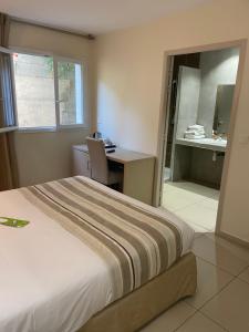 Postel nebo postele na pokoji v ubytování Hôtel A Madonetta