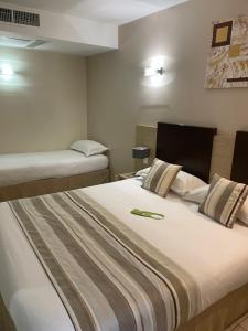 Postel nebo postele na pokoji v ubytování Hôtel A Madonetta