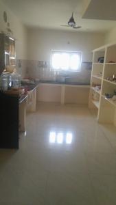 a large kitchen with a window in a room at SPALON Holiday Home in Hyderabad