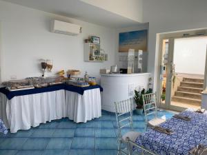 a kitchen with a table and a counter in a room at Appartamento Nonno Francesco in Ravello