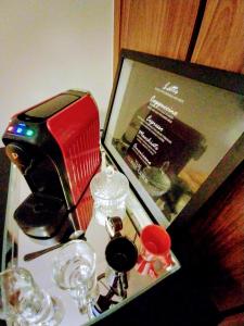 a table with a hair dryer and glasses on it at Hotel GranEstanConfor Veranda Berrini - Master Deluxe Duplex - Business Excellence - king Studio - by LuXXoR in Sao Paulo