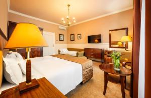 Postel nebo postele na pokoji v ubytování Esplanade Hotel Prague
