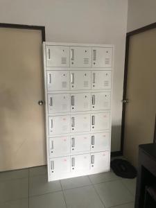 a stack of white boxes in a room at Moon Dolphin Hostel in Haad Rin