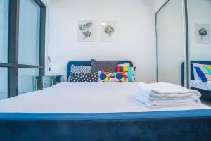 a bedroom with a large bed with a mirror at Minimalism modern apartment*waterview*parking＊IGA in Sydney