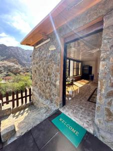 a stone house with a sign that reads mexico at Hiking break 