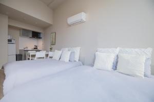 Una cama o camas en una habitación de The most comfortable and best choice for accommodation in Yoyogi SioY5