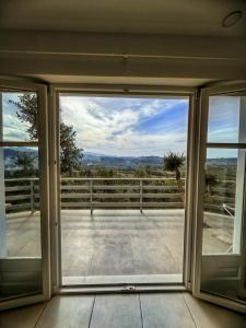 an open door to a balcony with a view at Olympian Heights in Olympia