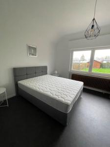 Llit o llits en una habitació de Villa Les Hauts de Heusy