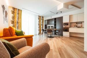 a living room with a couch and a table at VL Luxury Apartment - Housea in Polignano a Mare