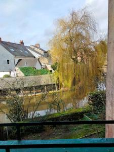 a view of a river from a window at Studio en RDC avec balcon centre Vitré in Vitré