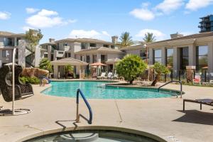 a swimming pool in the middle of a building at Kierland Commons CozySuites next to golf course in Scottsdale