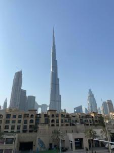 a view of the burj khalifa from the city at Silkhaus Downtown Burj Khalifa view 1BDR in Old Town in Dubai