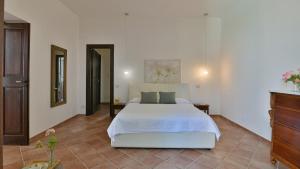 a bedroom with a large white bed in a room at VILLA AFRODITE 8, Emma Villas in Milazzo +27 photos
