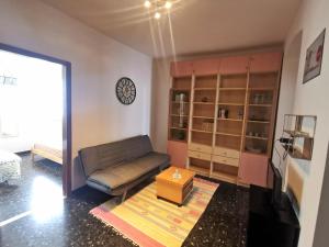 a living room with a couch and a coffee table at Dal Pontevecchio House in Casarza Ligure