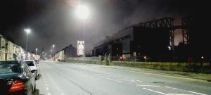 a street at night with cars parked on the road at 465 Bolton Road Next to Blackburn Stadium in Cherry Tree