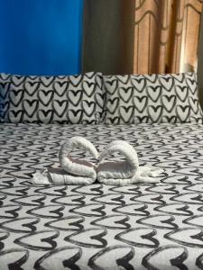 Postel nebo postele na pokoji v ubytování Rozay Travellers Inn