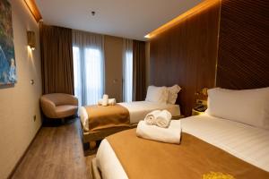 Postel nebo postele na pokoji v ubytování Kate Hotel Special Class & SPA