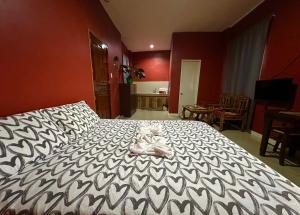 Postel nebo postele na pokoji v ubytování Rozay Travellers Inn