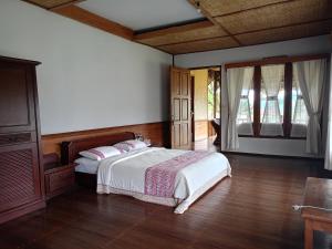 Säng eller sängar i ett rum på Sari Papandayan Resort Syariah