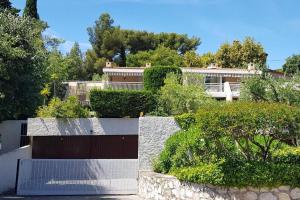 a view of a house with bushes and trees at "Côté Gibaou" Centre-ville Garage Piscine Terrasse in Cassis