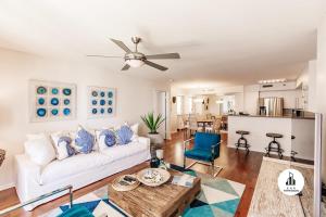 a living room with a white couch and a ceiling fan at Bnb Hyperion - Family-Friendly! 3BR, 2BA, Balcony in Miami