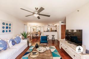 a living room with a white couch and a ceiling fan at Bnb Hyperion - Family-Friendly! 3BR, 2BA, Balcony in Miami