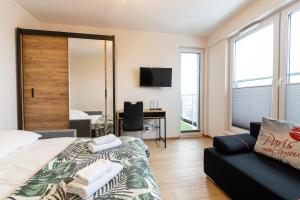 Μια τηλεόραση ή/και κέντρο ψυχαγωγίας στο Apartament z dwoma sypialniami i z miejscem postojowym