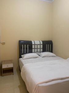 Ένα ή περισσότερα κρεβάτια σε δωμάτιο στο Tendy Guest House