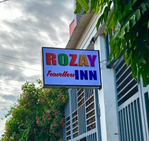 a sign for a railway television inn on a building at Rozay Travellers Inn in Kabankalan