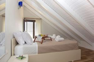 Ένα ή περισσότερα κρεβάτια σε δωμάτιο στο Belles Maisons - Nektarios