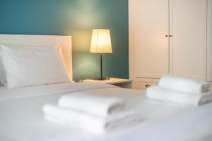 Postel nebo postele na pokoji v ubytování Pame Rentals - 2BD & 2BA Home, 4 Min to Acropolis